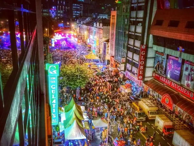Immediate crowds throng a sweltering avenue during Zurich's bustling street festival