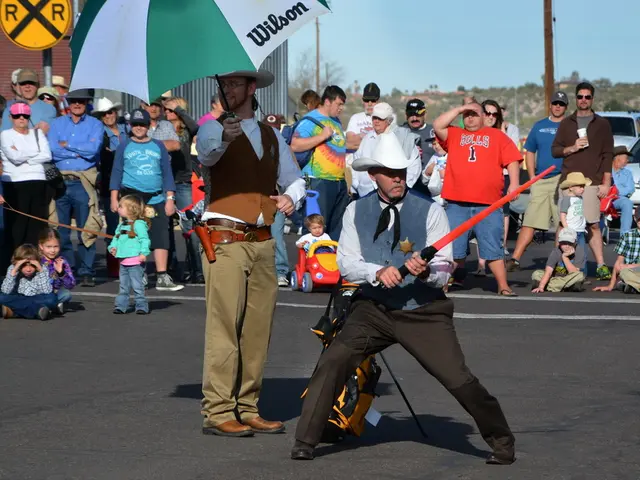 As we can see in the image there are few people here and there, toy car, an umbrella, buildings,...